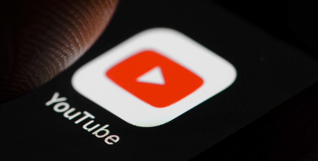 YouTube app icon on smartphone, video marketing for Dubai real estate