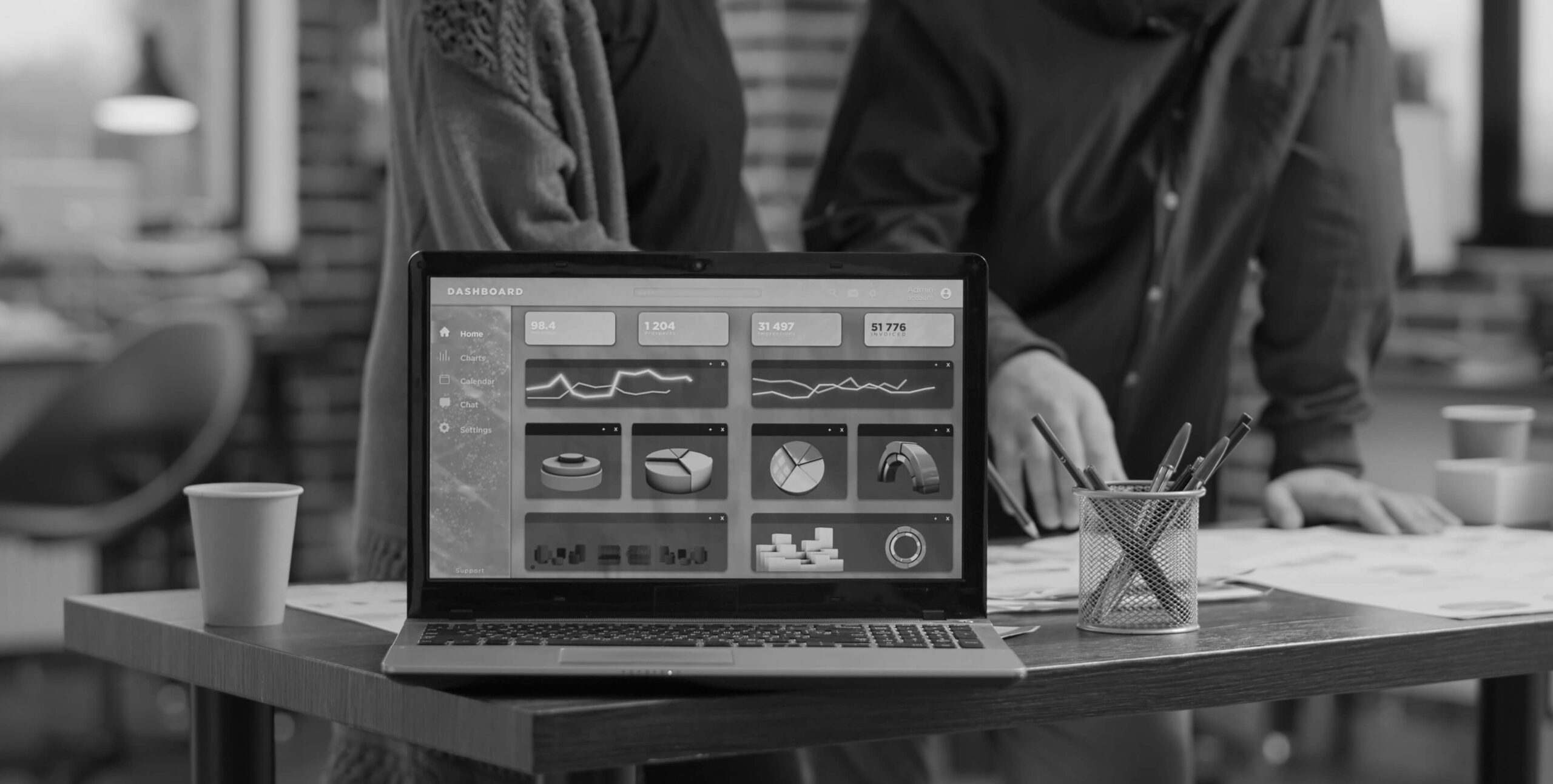 Laptop displaying a data dashboard, real estate marketing analytics