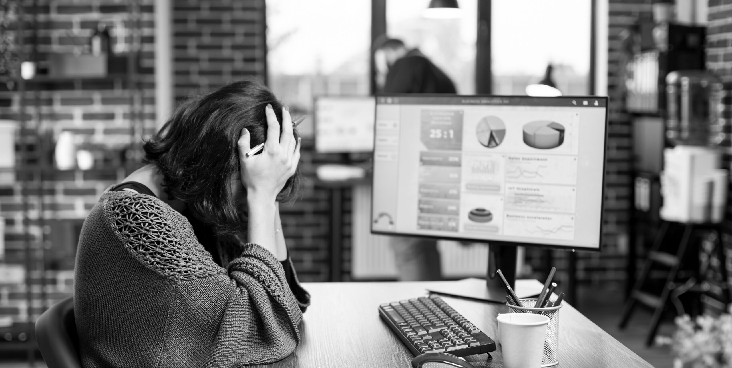 Stressed woman viewing a business dashboard, underperforming real estate campaigns