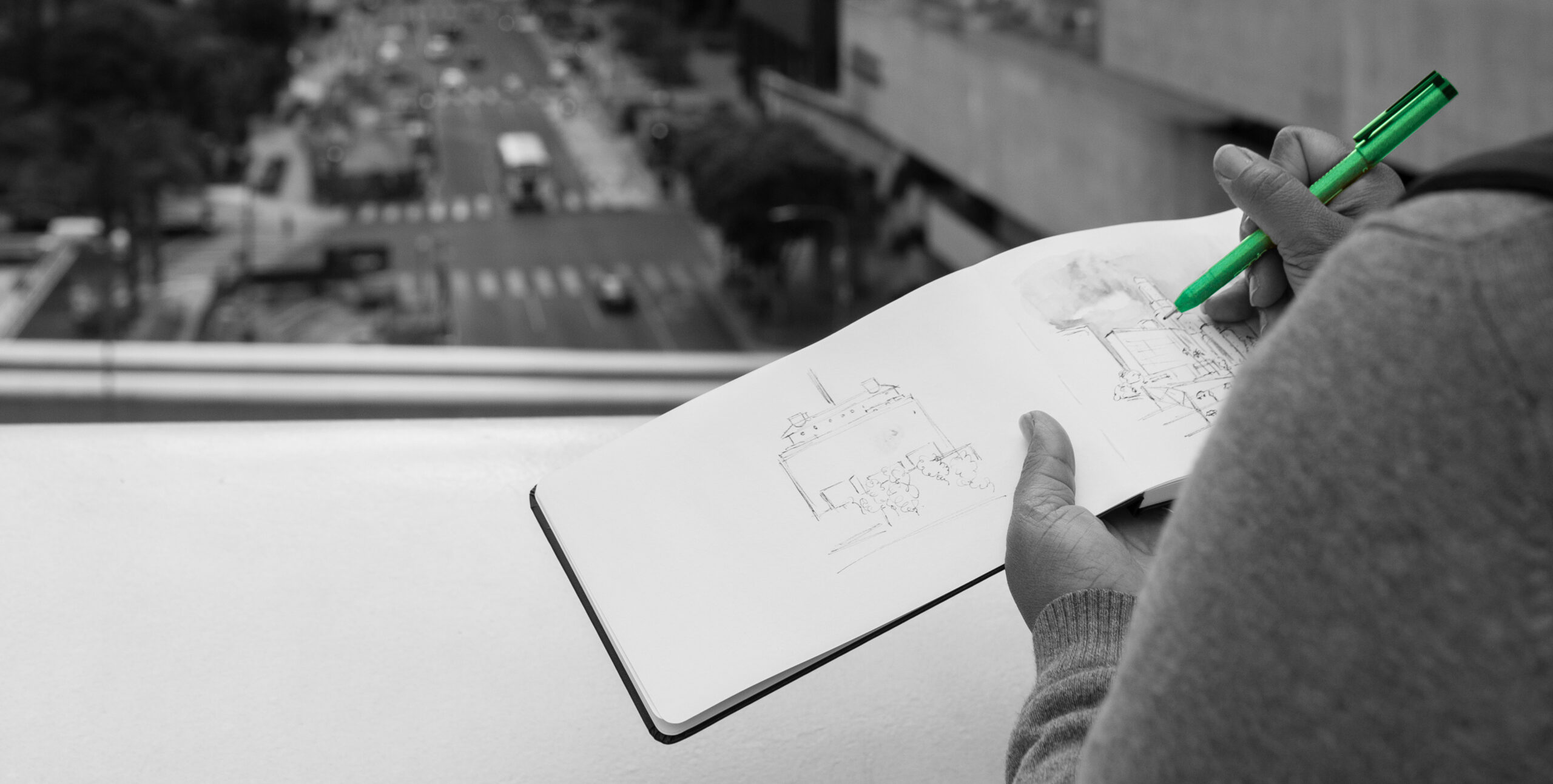 Person sketching a building elevation, architectural concept design