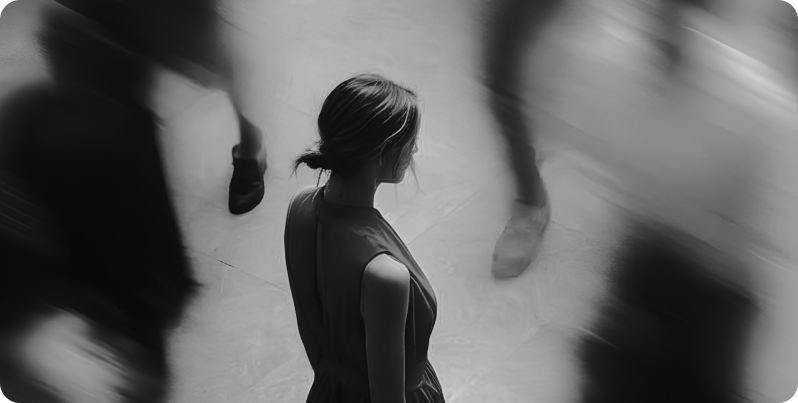 Woman standing still as people rush past, real estate brand standing out