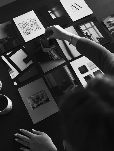 Hands browsing art prints display