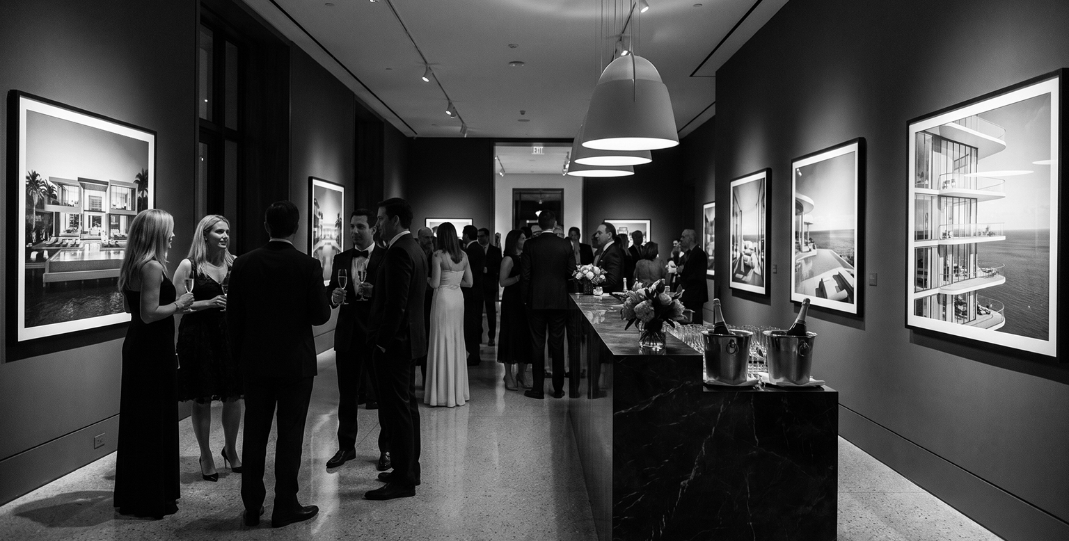 Guests at a luxury real estate gallery event, real estate showcase event